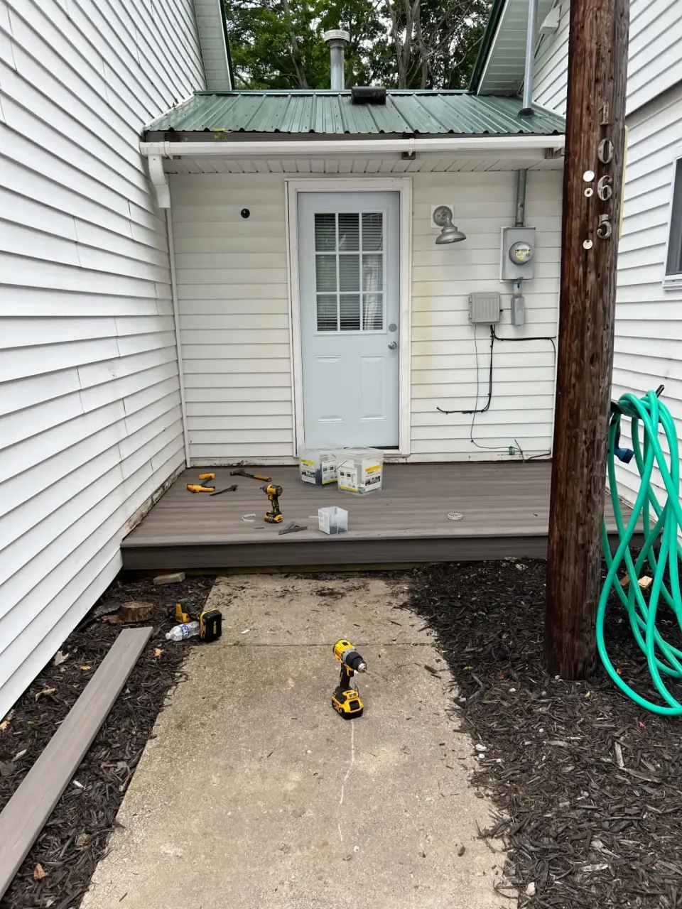 Composite deck landing being built at a side entry door